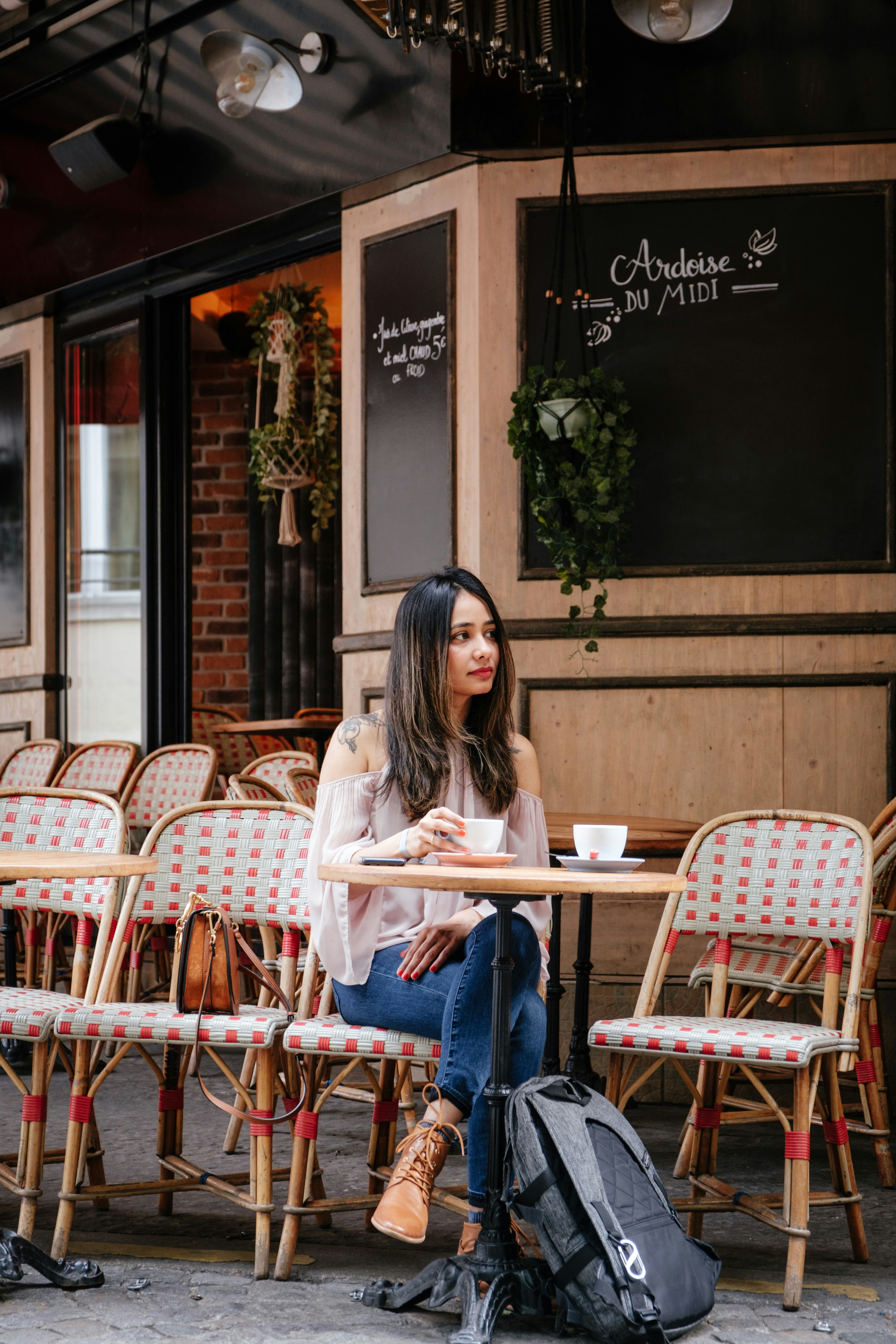 Woman sitting alone at a cafe